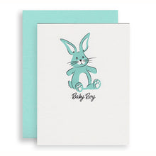 Baby Boy Bunny greeting card featuring a toy bunny is screen printed in blue and black inks.