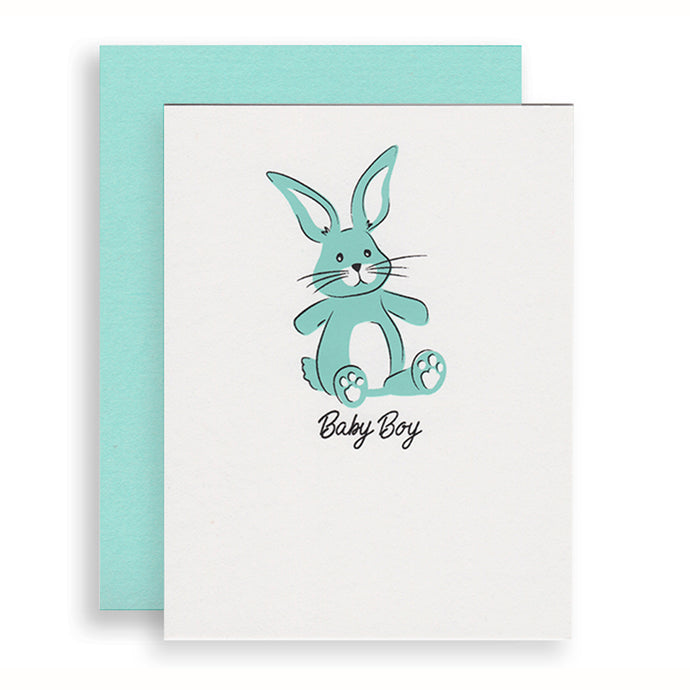 Baby Boy Bunny greeting card featuring a toy bunny is screen printed in blue and black inks.