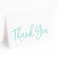 Hand lettered thank you card in large pale blue type on white paper with matching white envelope.