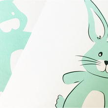 Baby Boy Bunny greeting card featuring a toy bunny is screen printed in blue and black inks.