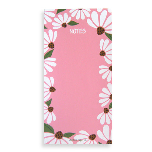Notes pad with white coneflowers on pink background.